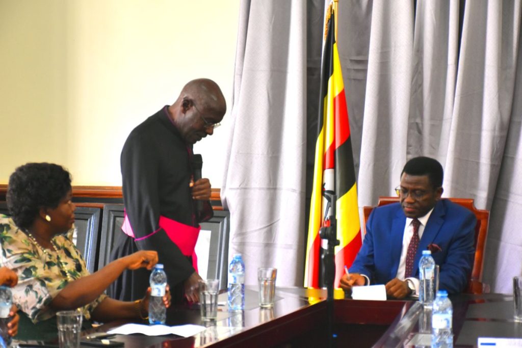 Msgr G.W. Lubega delivering a speech on behalf of Bishop Serverus Jjumba